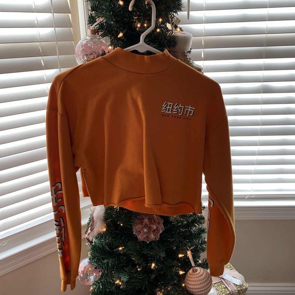 yellow turtleneck cropped nyc sweatshirt